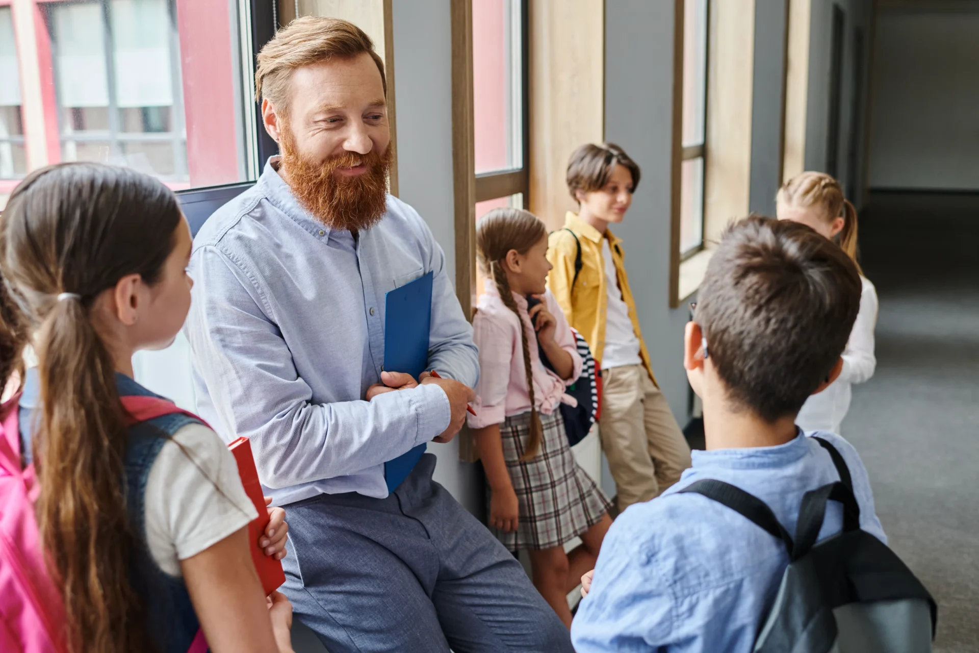Elementary Teacher Smiling at School Kids